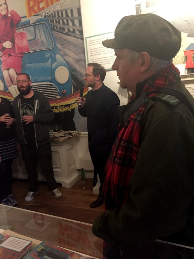 Simon O'Connor, Little Museum curator and designer of exhibition, introduces Pat McCabe to open exhibition.